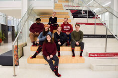 Luddy School students pose on stairway promoting the Luddy Step Up Fund